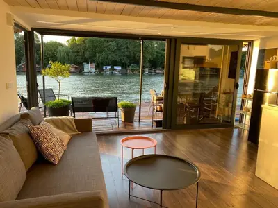 a living room with a couch and a table at Loup 1981 in Bežanija