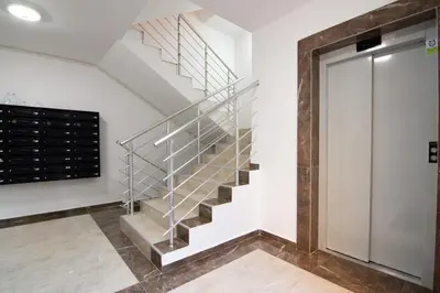 a staircase in a house with a metal railing at Martha apartments in Belgrade