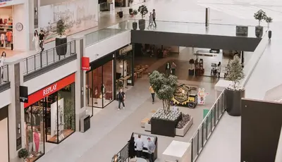 an overhead view of a shopping mall with people walking in it at Belgrade Waterfront Luxury Studio in Belgrade