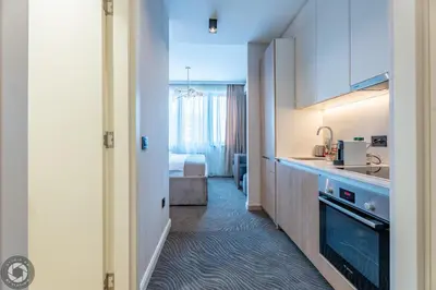 a kitchen with a sink and a counter top at Belgrade Waterfront Luxury Studio in Belgrade