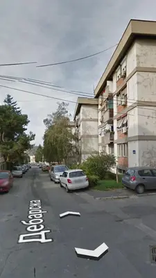 a street with cars parked in a parking lot at Aurora in Belgrade