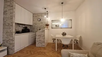 a kitchen and dining room with a table in a room at Aurora in Belgrade