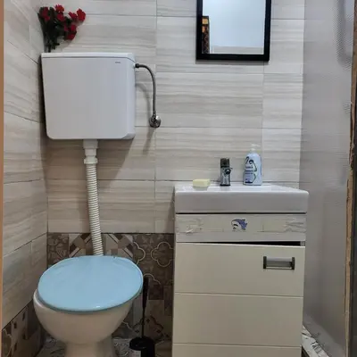 a bathroom with a toilet and a sink at JASMIN suites in Belgrade