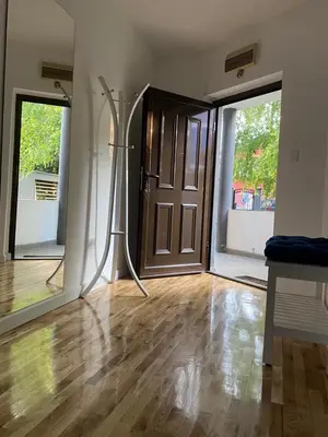 an empty room with a door and a wooden floor at House Reko in Novi Grad
