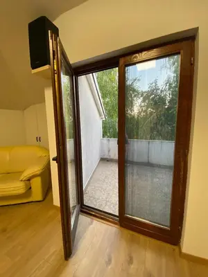 a sliding glass door in a room with a balcony at House Reko in Novi Grad
