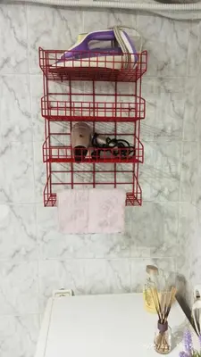 a bathroom with a red shelf above a sink at Apartman Oaza Olja in Belgrade