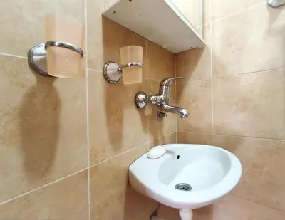 a bathroom with a white sink and a mirror at Ada Belgrade Apartment in Belgrade