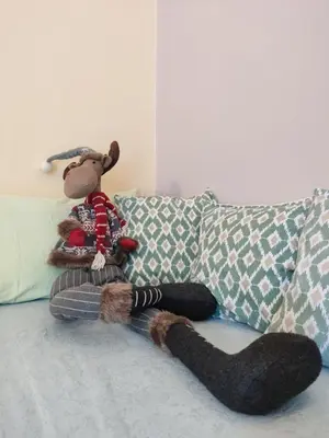 a stuffed animal sitting on top of a couch at Ada Belgrade Apartment in Belgrade