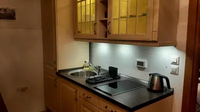 a kitchen with a sink and a counter top at Modern Lux Studio w Inside parking 5 min from Skadarlija, Republic Sqre in Belgrade