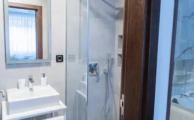 a bathroom with a shower and a sink at 9 Nine - Luxury Apartments & Suites in Belgrade