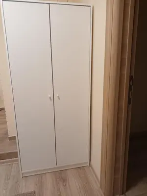 a white closet with a glass door in a room at Apartman Marina in Sajmište