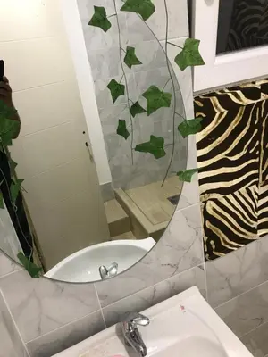 a bathroom with a mirror and a sink at cunami kucica sa bazenom in Belgrade