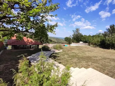 a view of a yard with a building at Vila Banda in Sremski Karlovci