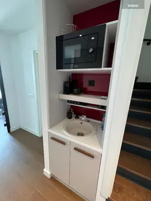 a bathroom with a sink and a microwave at BW TERRACE top floor apartments with river view & self check-in in Belgrade