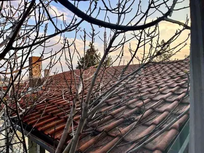 a roof of a house with a clock on it at Verica in Vračar (historical)