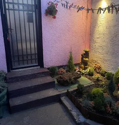a front door of a house with a bunch of plants at Verica in Vračar (historical)