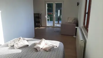 a bedroom with a bed with two white pillows on it at Green sanctuary 30 min from downtown Belgrade in Donja Ralja