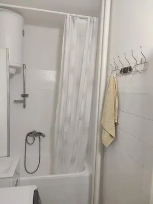 a bathroom with a shower with a shower curtain at Apartment Miljakovac in Belgrade