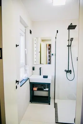 a bathroom with a sink and a shower at Templum Appart-Hotel -SELF CHECK IN - Slavija square in Belgrade