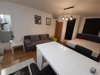 a living room with a couch and a table at Zorz in Belgrade