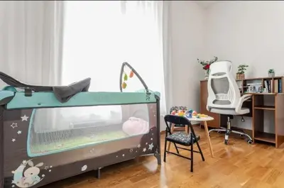 a bed in a room with a table and a chair at Penthouse Danube Exclusive, Parking, 90m2, Wifi in Novi Grad