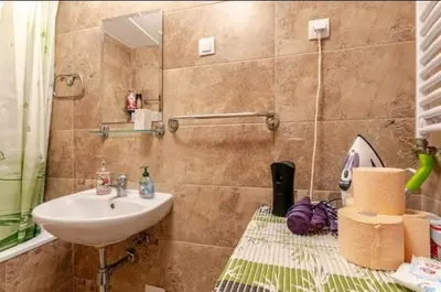 a bathroom with a sink and a mirror at Penthouse Danube Exclusive, Parking, 90m2, Wifi in Novi Grad