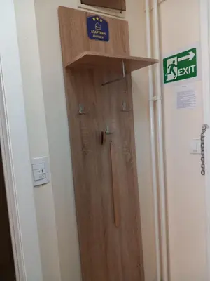 a wooden door in a room with a sign on it at Libero 78 in Vračar (historical)