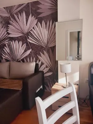 a living room with a couch and a chair at Libero 78 in Vračar (historical)