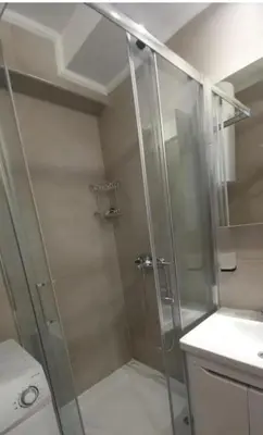 a shower with a glass door in a bathroom at Libero 78 in Vračar (historical)
