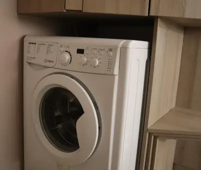 a white washer and dryer in a room at The Empress apartment Belgrade in Belgrade