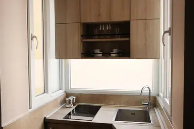 a kitchen with a sink and a window at The Empress apartment Belgrade in Belgrade