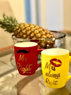 two mr and mrs mugs on a table with a pineapple at Hugolina LUX in Belgrade