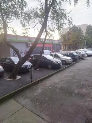 a row of cars parked in a parking lot at Cezar in Arandjelovac