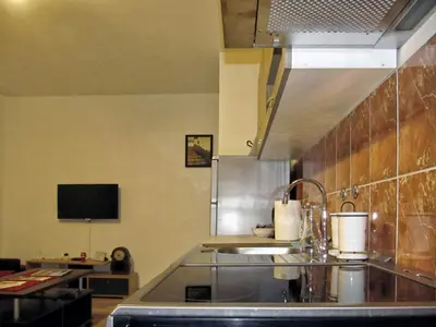 a kitchen with a sink and a counter top at Cezar in Arandjelovac