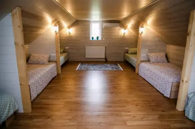 a room with two beds in a tiny house at Kućerak Sofija in Čortanovci