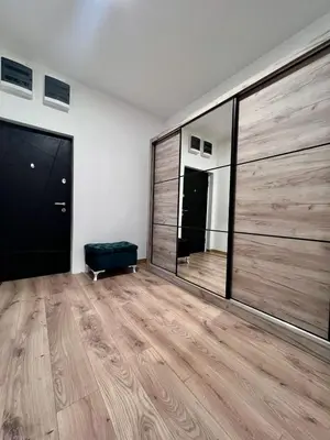 a room with a large room with wooden floors and a large sliding door at Hugo Bianca LUX in Belgrade
