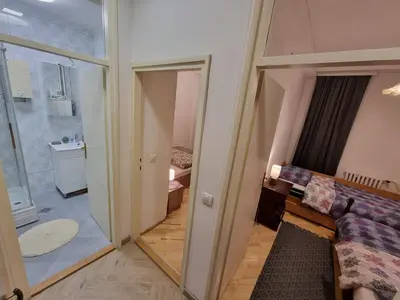 a small room with a door to a room with a bathroom at Big Downtown Apartment across National Theater (2 Bedrooms) in Belgrade