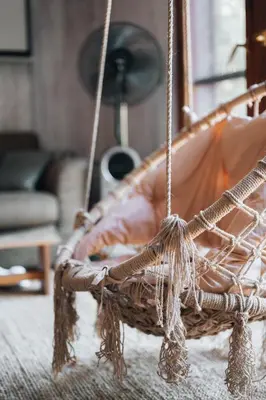 a rope swing in a living room with at Rent a Forest, Cabin Hidden in the Fruška gora in Velika Remeta