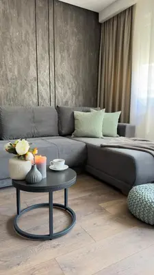 a living room with a couch and a table at DOM Boutique Apartments OLD TOWN in Belgrade