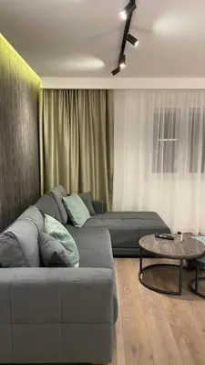 a living room with a couch and a table at DOM Boutique Apartments OLD TOWN in Belgrade