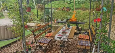 a model of a garden with a table with food at Smokvica in Stari Slankamen