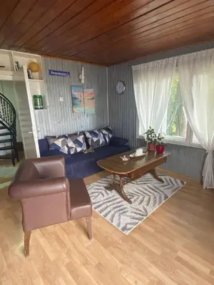 a living room with a table and a couch at Smokvica in Stari Slankamen