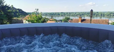 a water fountain with a view of a river at Smokvica in Stari Slankamen