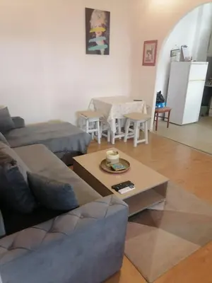 a living room with a couch and a table at Flat in Belgrade city center, 45m2 in Belgrade