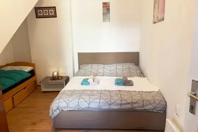 a bedroom with a bed with two pillows on it at Flat in Belgrade city center, 45m2 in Belgrade