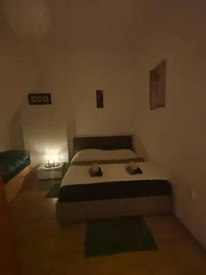 a bedroom with a bed with two hats on it at Flat in Belgrade city center, 45m2 in Belgrade