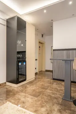 a lobby with a large glass wall at Knez Imperium in Belgrade