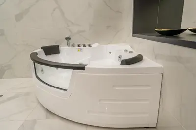 a white bathroom with a sink and a mirror at Knez Imperium in Belgrade