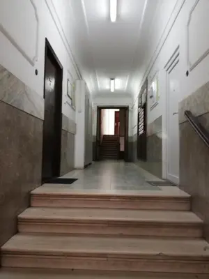 a hallway of a building with stairs and a door at Apartman Valdano in Belgrade