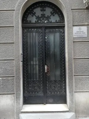 a black door on a building with a window at Apartman Valdano in Belgrade